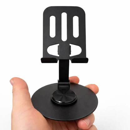 Foldbar mobilholder i metal vist i hånden