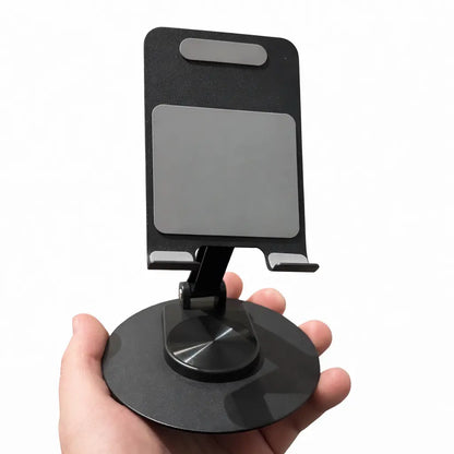 Stabil mobilholder i metal holdt i hånden